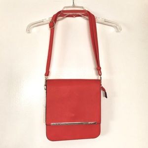 Coral leather shoulder bag with gold accents